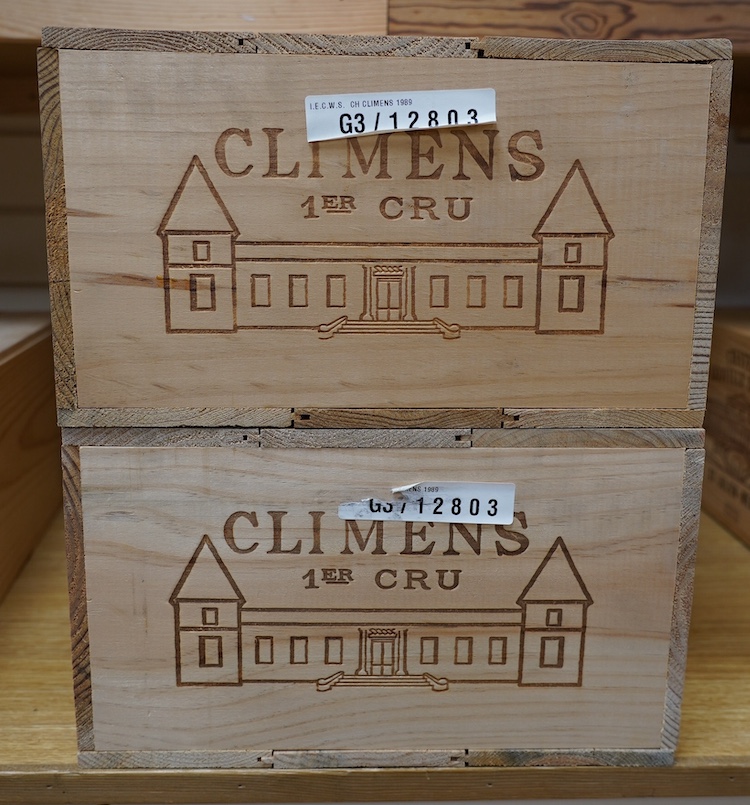 Two sealed cases of twelve bottles (twenty-four bottles) of 1989 Chateau Climens, Sauternes, in OWC's, purchased en primeur from The Wine Society. Condition - good